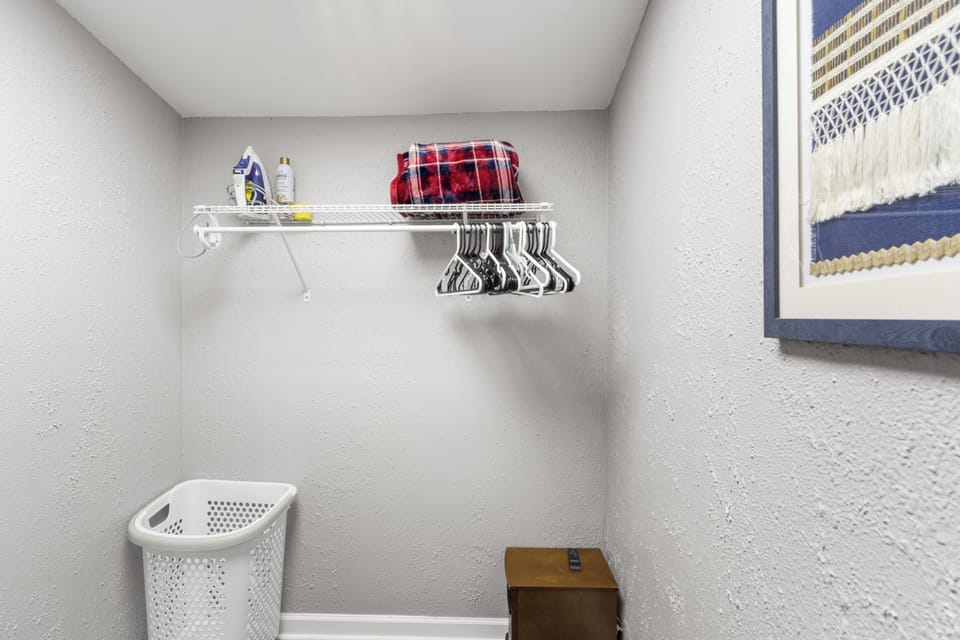 Unpack and make yourself at home with plenty of hangers, and extra blankets, all tucked away in this convenient walk-in closet.
