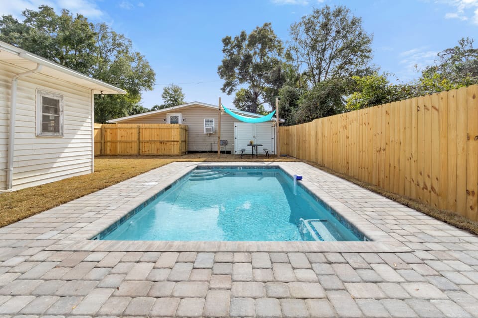 Dive into relaxation with this stunning saltwater pool, nestled in a private, fully fenced backyard. The crystal-clear water offers a refreshing escape, perfect for a leisurely swim or a fun splash with family and friends. Surrounding the pool is a stylish paver patio, providing ample space for lounging in the sun or enjoying an evening under the stars. A cozy shaded area with ...