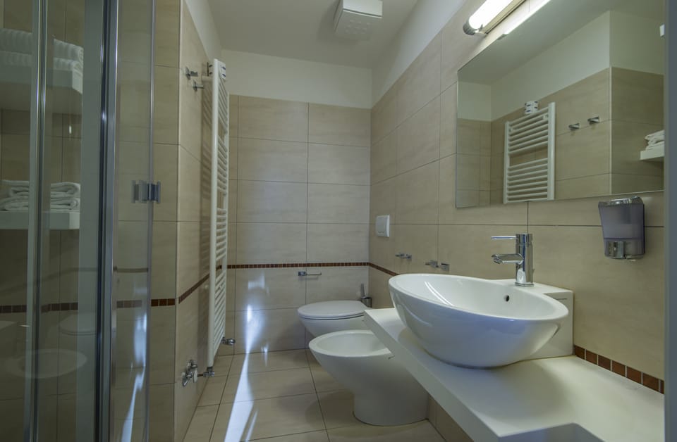 Rainfall showerhead, free toiletries, hair dryer, slippers