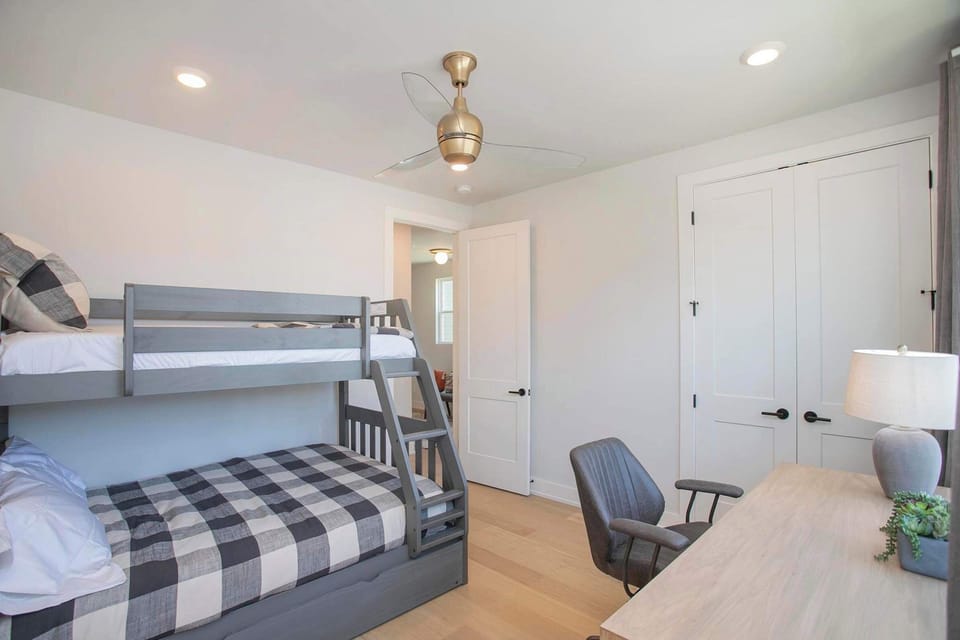 Bedroom 1 with twin/queen bunk bed, twin trundle, and work space