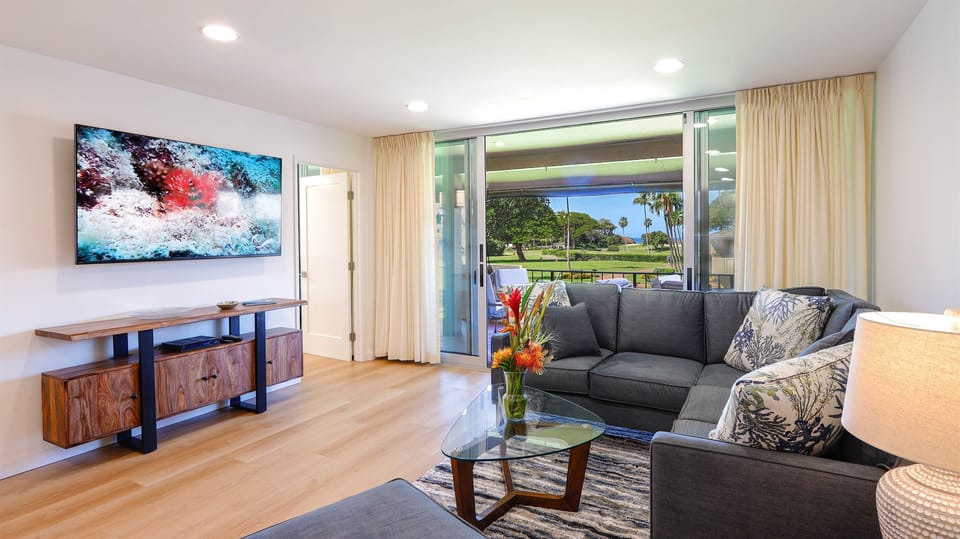 Living room opens to lanai with ocean views