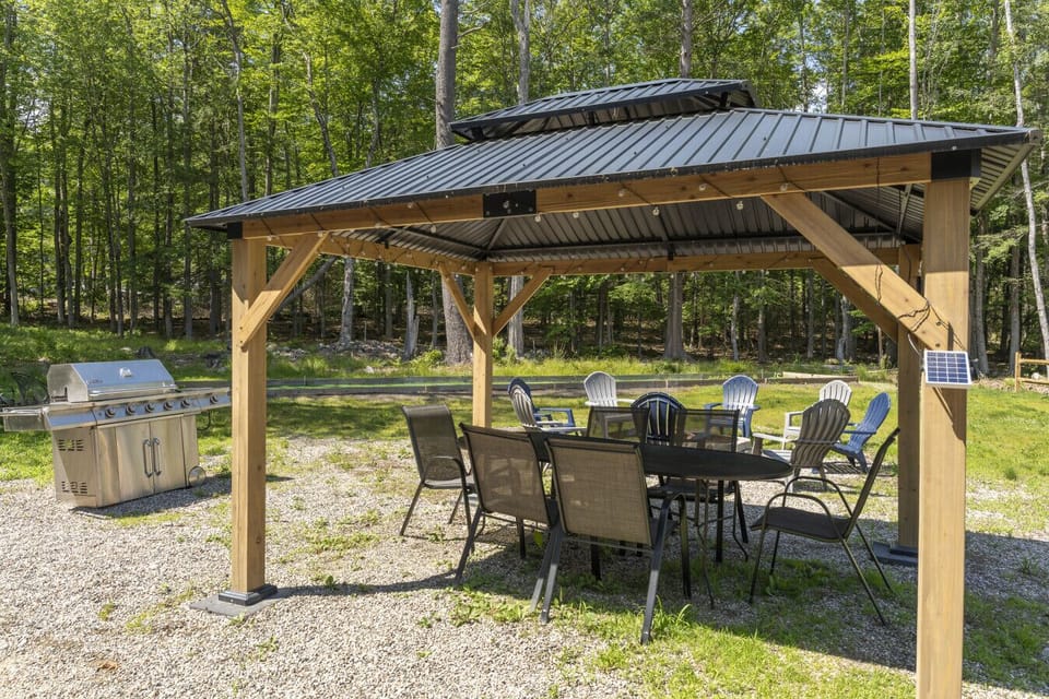 Grill your favorite meals in this shaded outdoor kitchen and enjoy open-air dining.