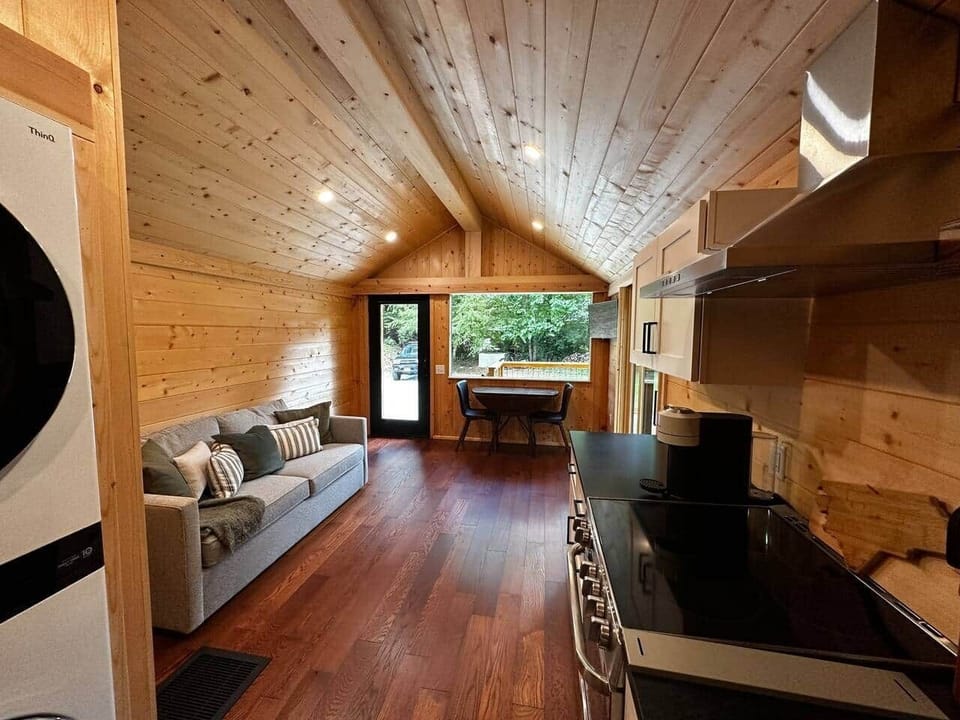 Light-filled gathering space that opens directly to the large deck and outdoor seating.