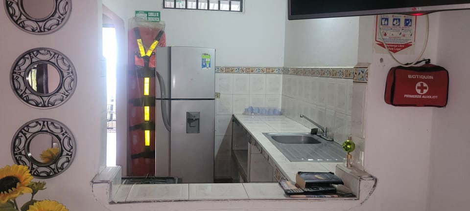 Full-size fridge, stovetop, dishwasher, cookware/dishes/utensils
