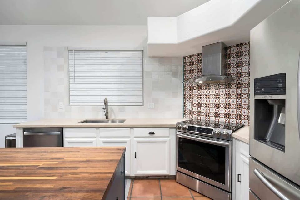Fully-equipped kitchen with quality appliances and a complete set of cookware