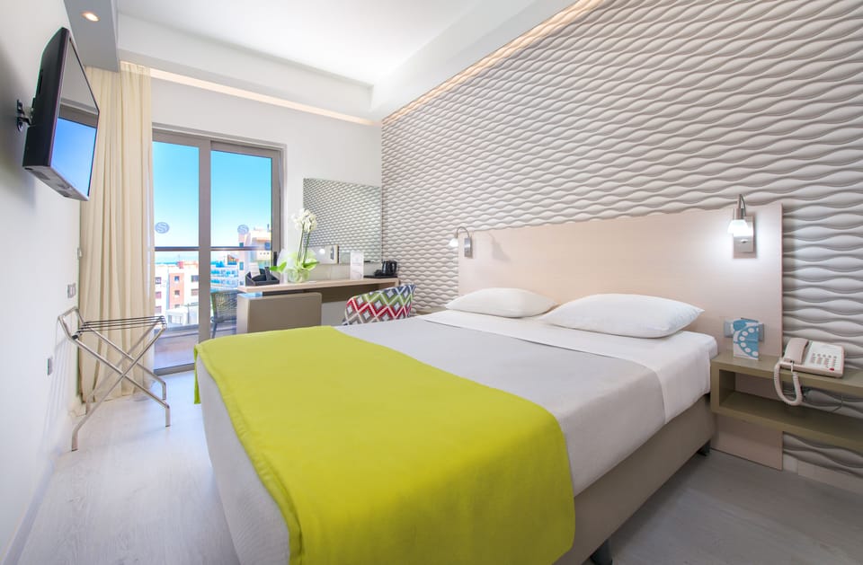 Standard Room, Partial Sea View | Minibar, in-room safe, desk, soundproofing