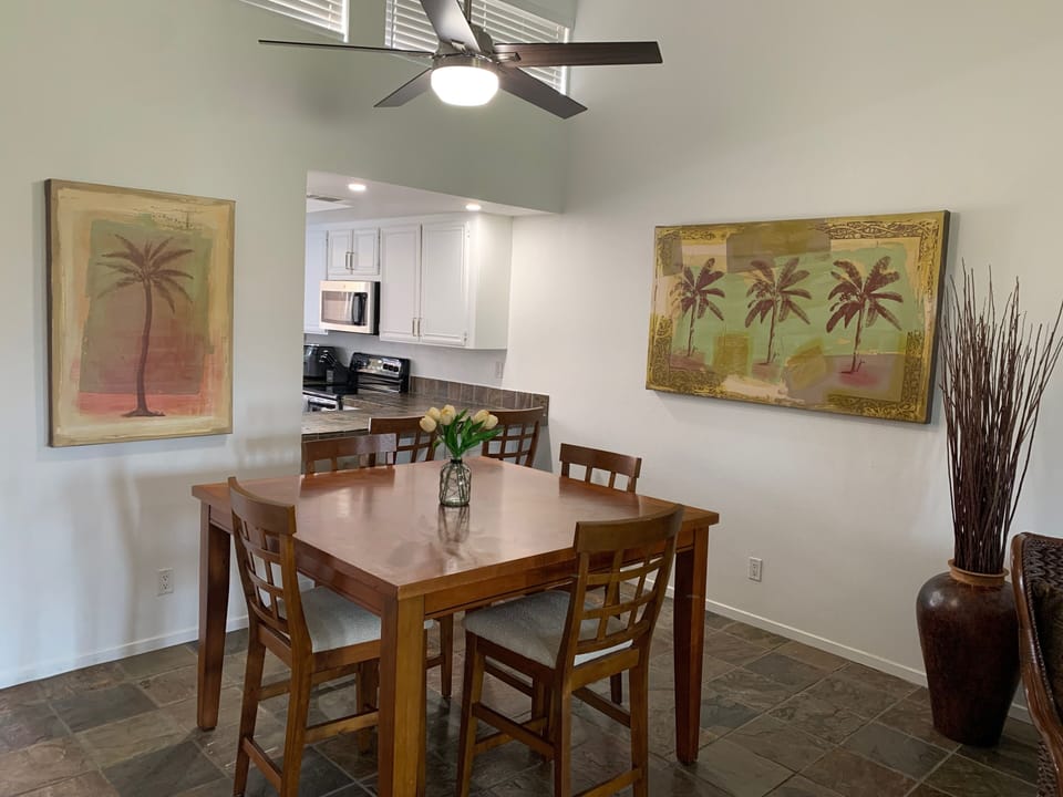 Dining room table with 4 chairs and bar with the remaining 2 
