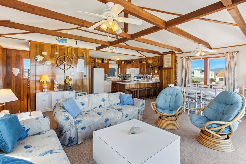 Relax in the beautiful Living Area with plenty of cozy furniture, unbeatable views of the ocean, and a flat screen tv!