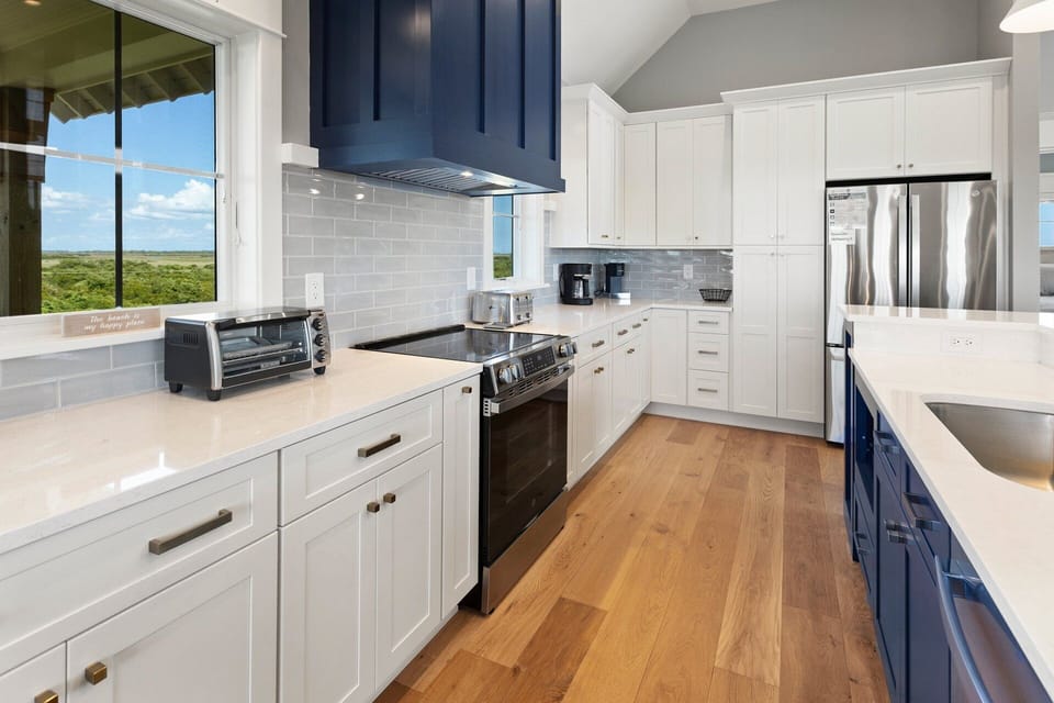 Whip up something delicious in the gorgeous modern Kitchen with expansive island!