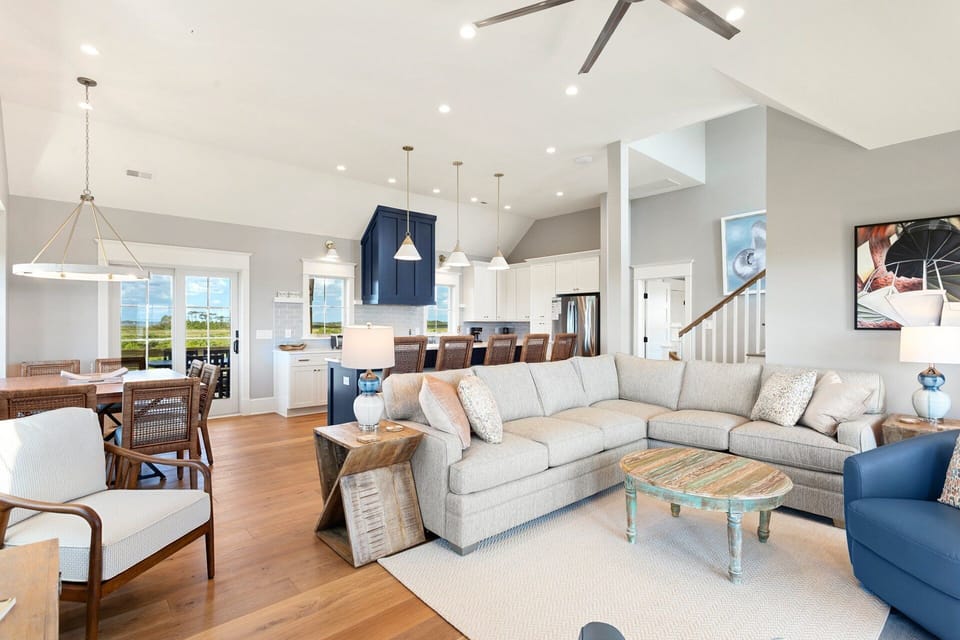 Relax in the Top Level Living Area with cozy furniture, a flat screen TV, and immaculate views.