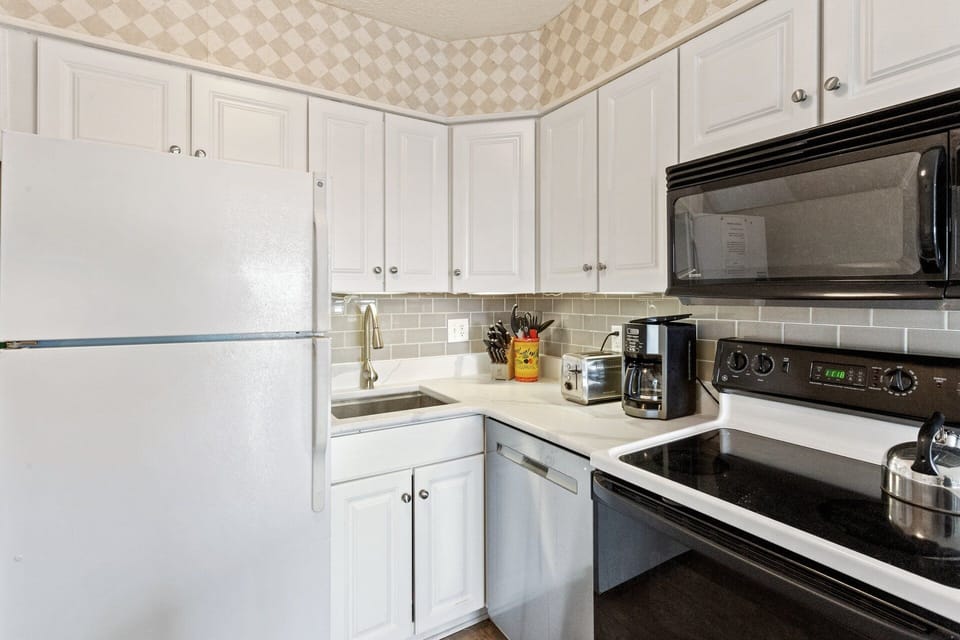 The chic Kitchen offers the ultimate space to prepare your favorite meal.