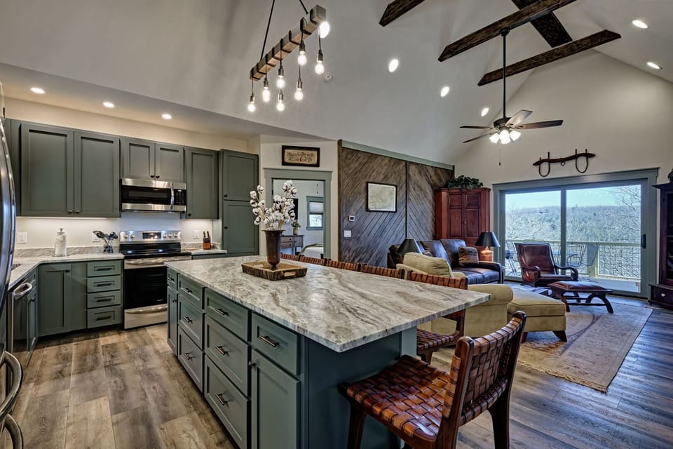 Kitchen, bar and living room, doorway to master bedroom