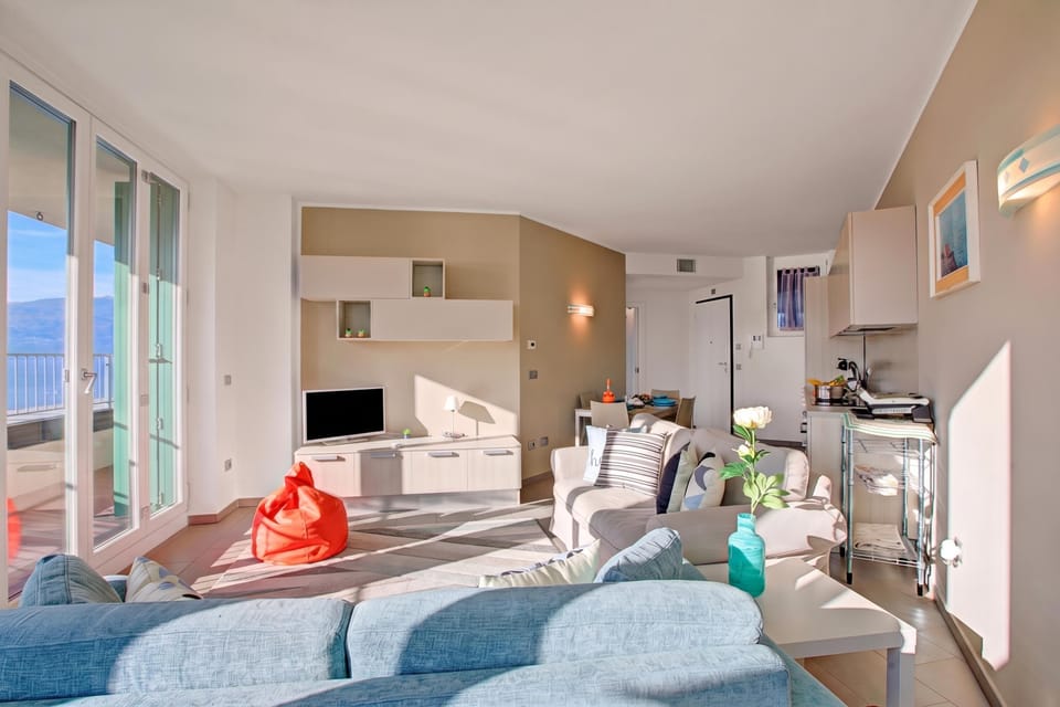 Family Apartment, 2 Bedrooms, Balcony, Lakeside (Sogno Sul Lago, Lakefront Balcony) | Living area | Flat-screen TV