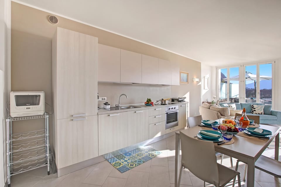 Family Apartment, 2 Bedrooms, Balcony, Lakeside (Sogno Sul Lago, Lakefront Balcony) | Private kitchen | Dining table