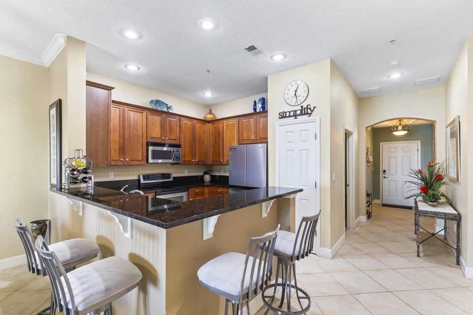 Modern kitchen with counter seating, perfect for casual meals or socializing while cooking.