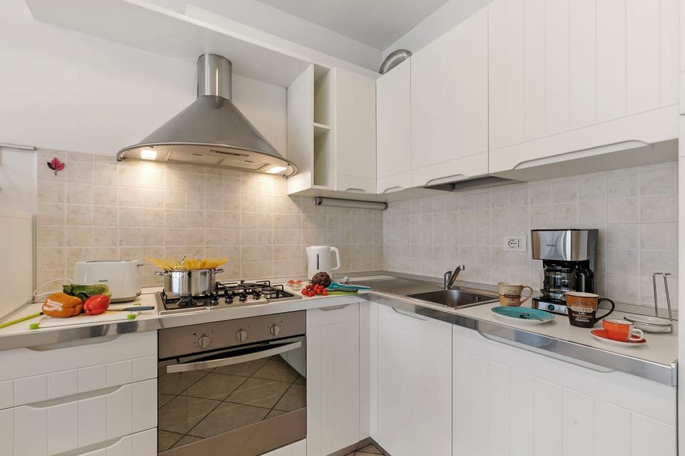 Family Apartment, 2 Bedrooms, Balcony (Torbolino) | Private kitchen