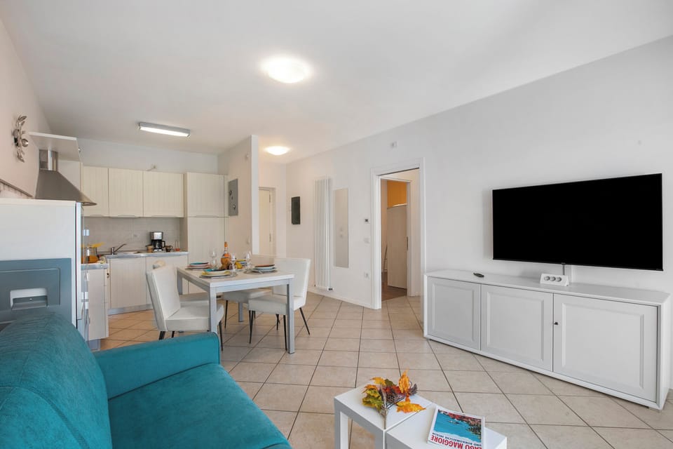 Family Apartment, 2 Bedrooms, Balcony (Torbolino) | Living area | Flat-screen TV