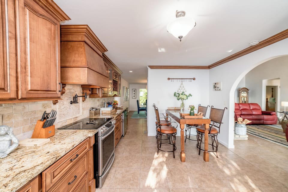 Spacious kitchen with an additional dining area.