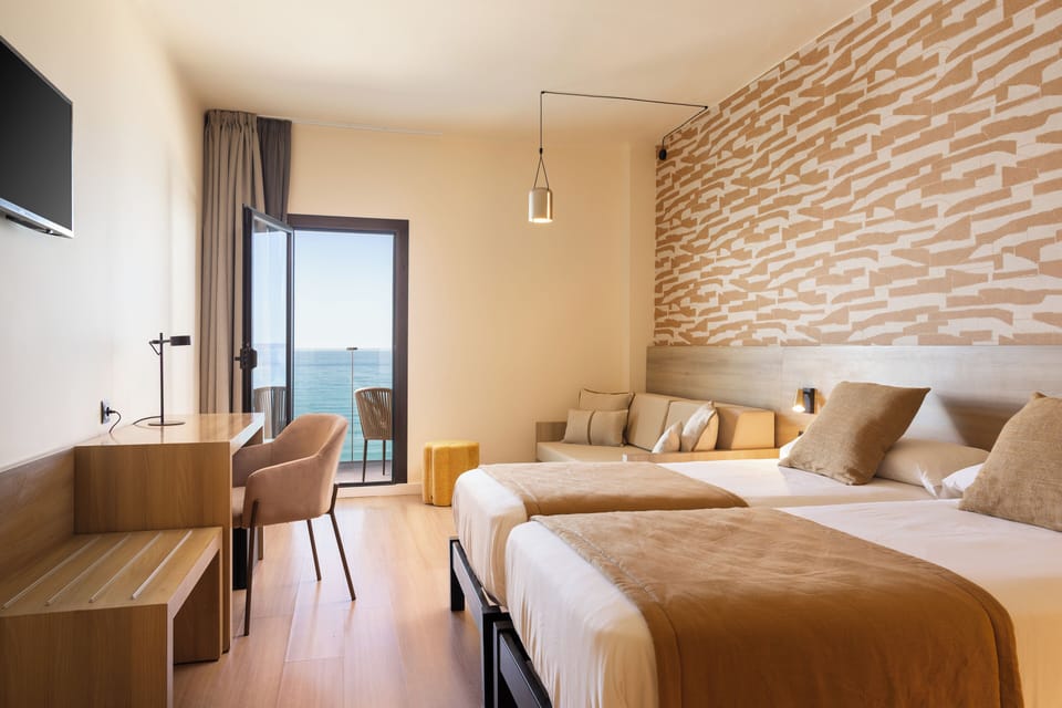 Twin Room, Balcony, Sea View | In-room safe, desk, blackout drapes, iron/ironing board