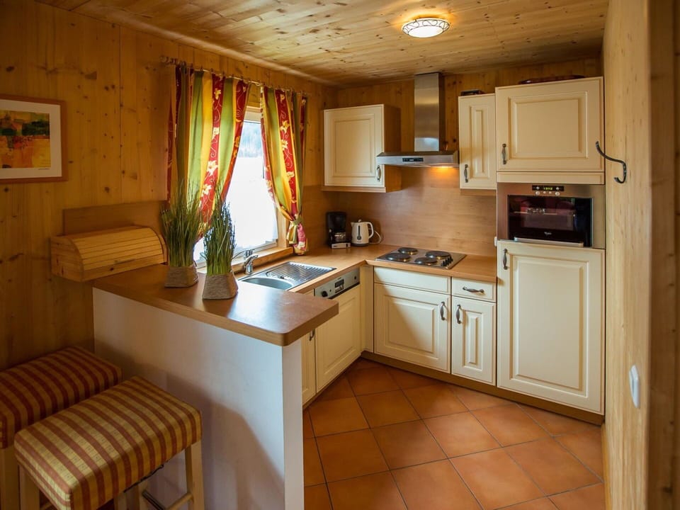 Furniture, Interior Design, Flooring, Wood, Kitchen, Floor, Cabinetry, Countertop, Room, Kitchen Appliance