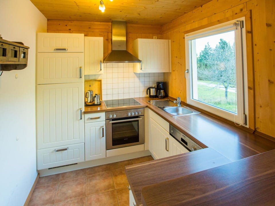 Flooring, Kitchen, Interior Design, Countertop, Wood, Cabinetry, Floor, Ceiling, Kitchen Appliance, Furniture
