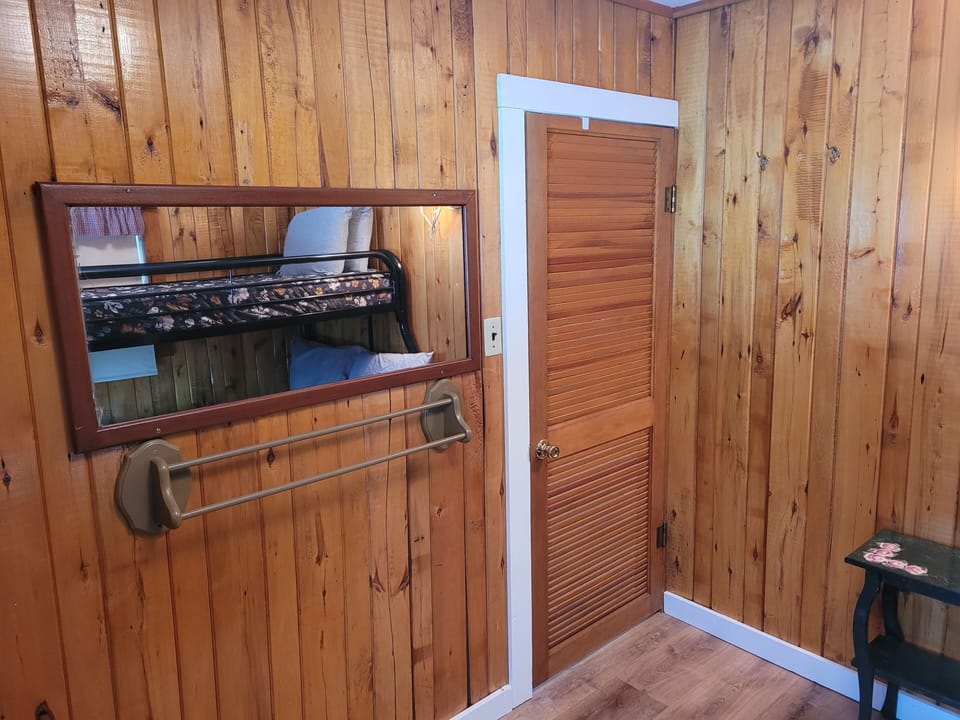 BEDROOM #2:  Features a twin-on-full bunk bed, which allows 3 people to sleep in the room.  Also includes a dresser and mirror.