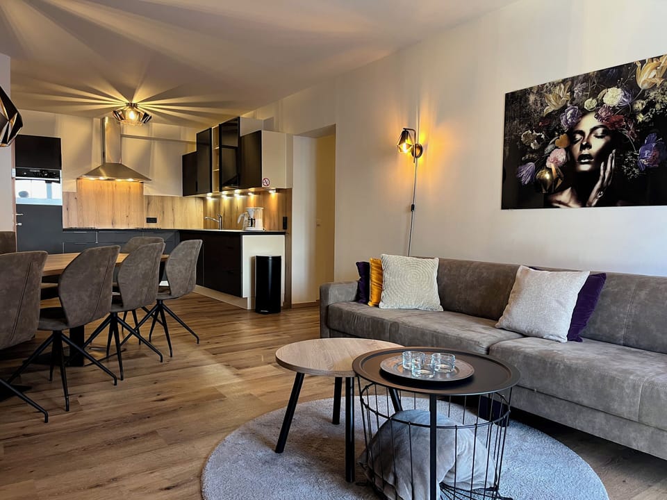 Comfort Apartment, 3 Bedrooms, Sauna, Mountain View | Living area | 50-inch flat-screen TV with cable channels