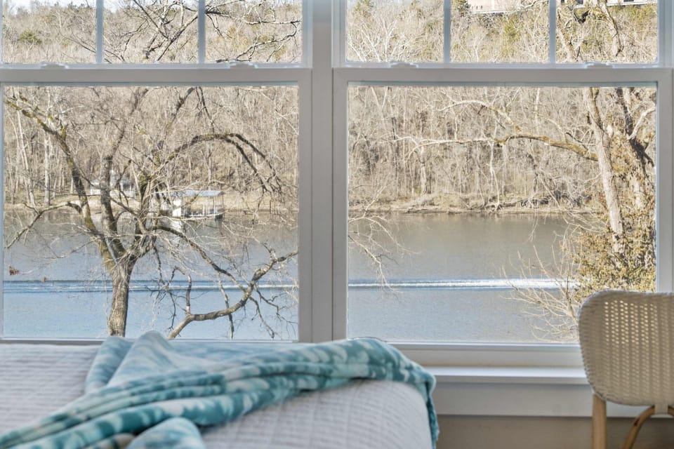 The chic king suite boasts an ensuite bath, smart TV, & deck access