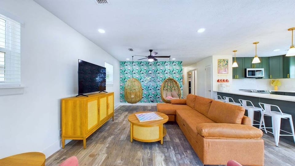 Relax in the spacious living room with comfortable seating for everyone. Enjoy your favorite shows on the TV or play board games for some screen-free fun. A cozy space perfect for unwinding and spending quality time with family or friends