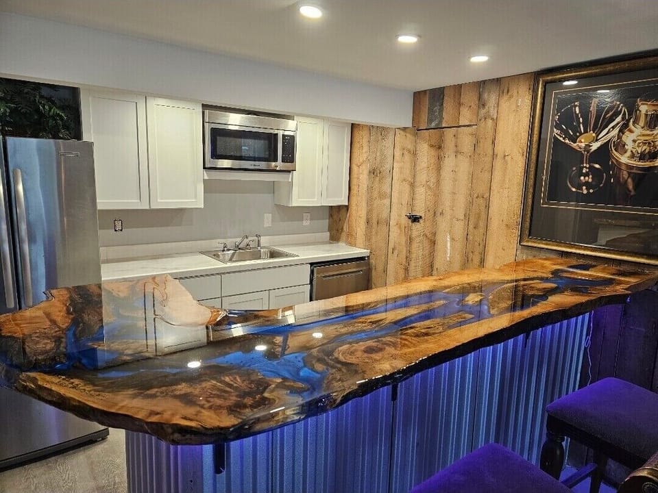 Sleek, modern kitchenette with premium finishes and full appliances