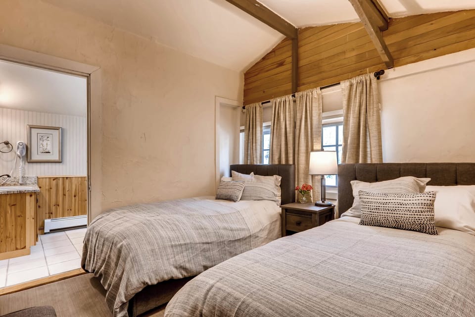 Bright and airy retreat with vaulted ceilings and soft natural light, perfect for restful mornings.