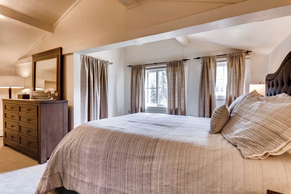 Spacious and inviting bedroom adorned with neutral tones, offering a tranquil escape.