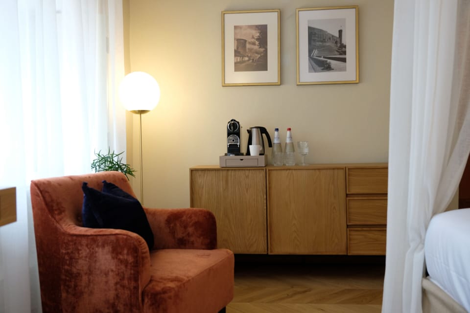 Romantic Canopy Room | Living area | 48-inch flat-screen TV with digital channels, books, heated floors