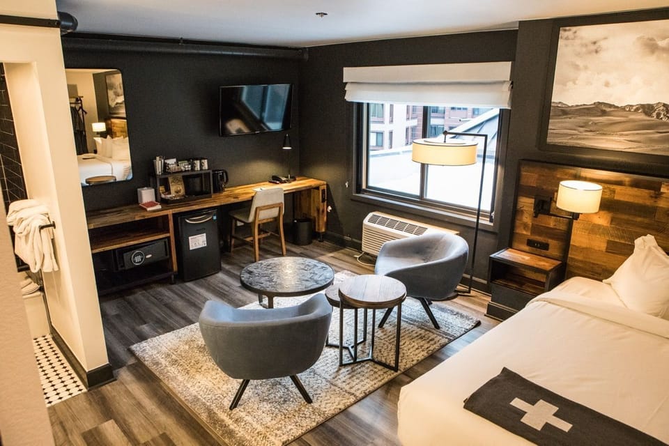 Stylish and cozy retreat with warm wood tones, soft lighting, and a relaxing seating area.