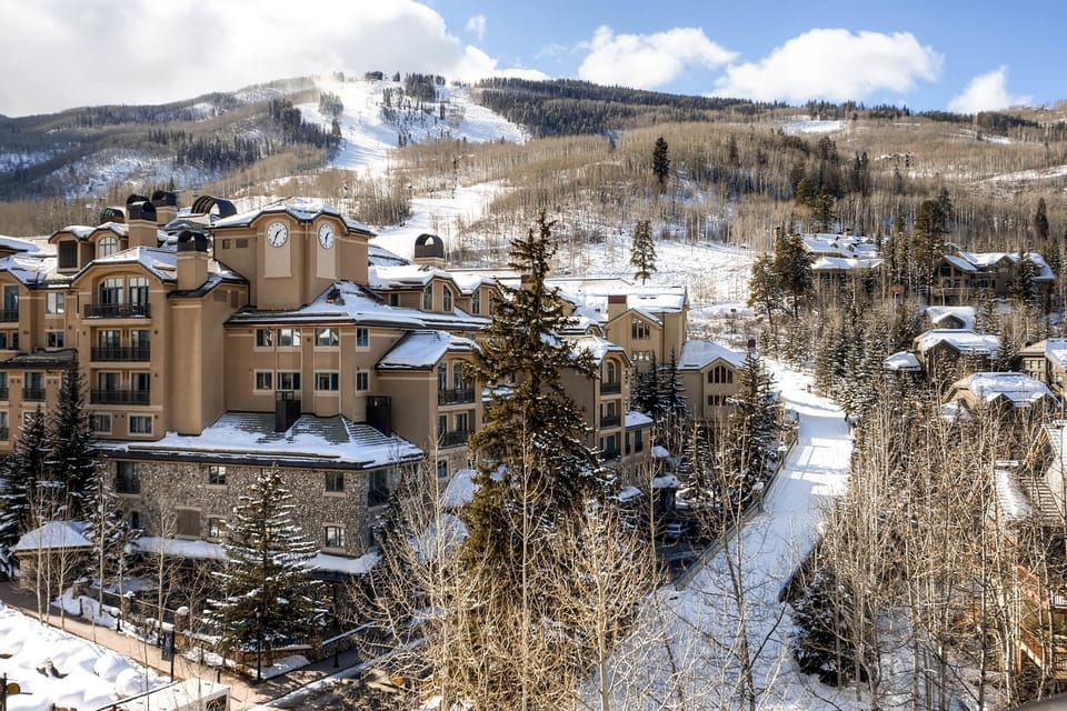 Picturesque mountain retreat with cozy lodges and breathtaking vistas, ideal for a serene winter escape.
