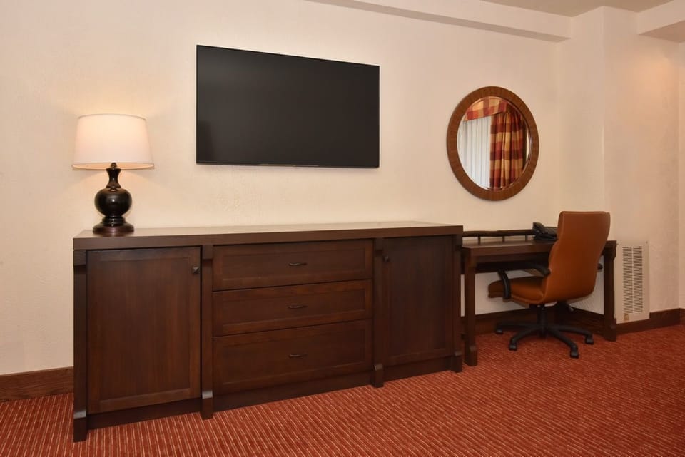 Well-appointed workspace with a sleek desk, comfortable chair, and modern decor for productivity and comfort.