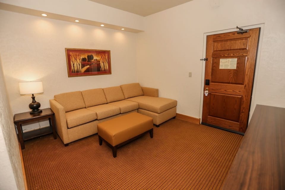 Stylish living space featuring a comfortable sofa, soft lighting, and tasteful decor for a relaxing retreat.