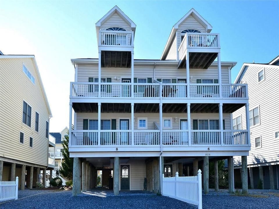 Stunning multi-level townhouse just steps from the beach, featuring spacious balconies for breathtaking ocean air.