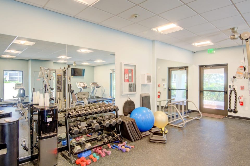 Fully equipped home gym with natural light and modern gear