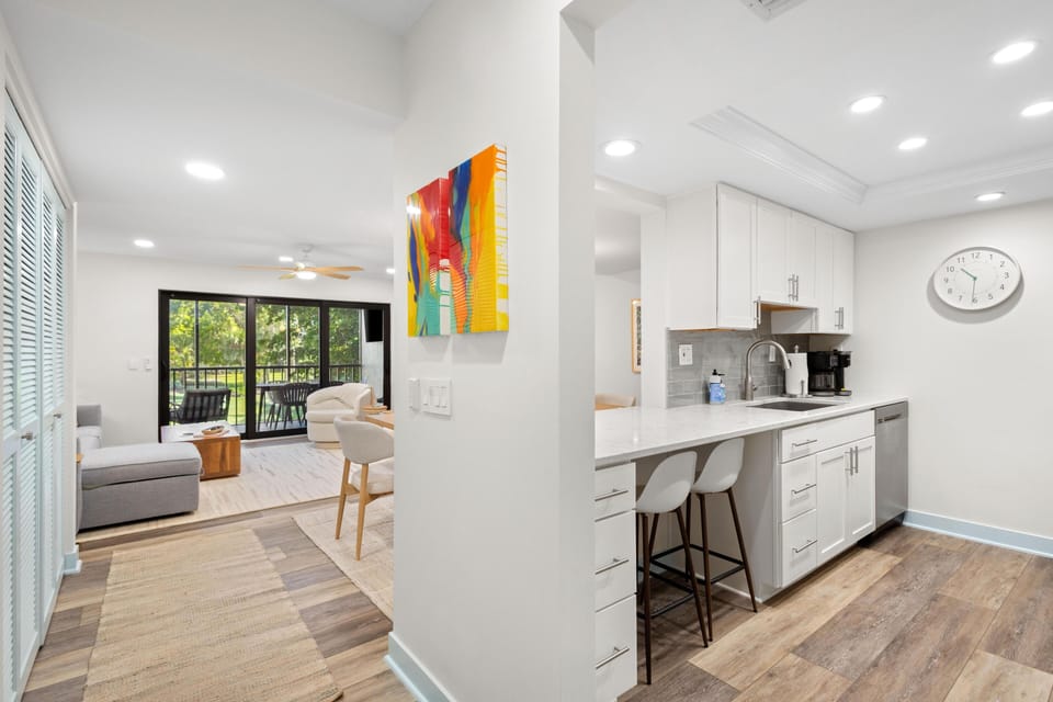 Bright, open kitchen and living area with garden views