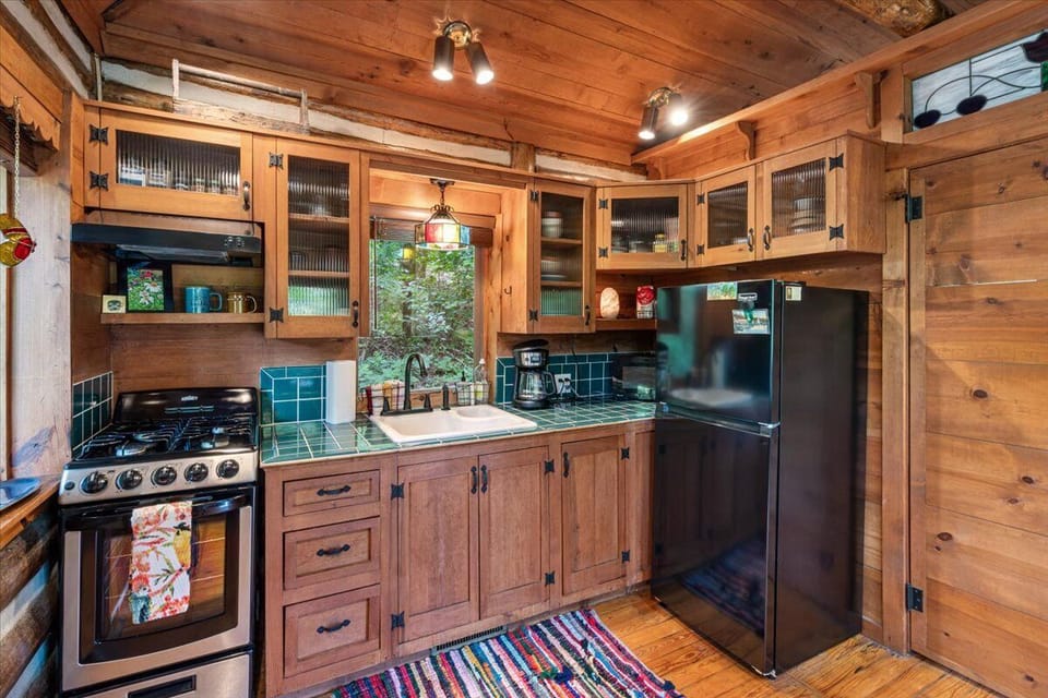 kitchen gas oven stainless steel pots pans coffee and teas for guests