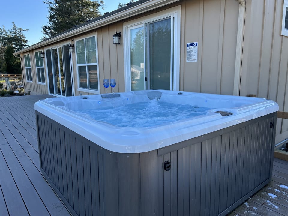 The hot tub is available year round and fully sanitized before your stay. You can access the tub through the living room sliders or the sliders in the primary bedroom.