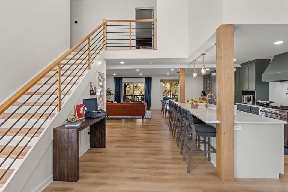 Welcome home! From the moment you step inside, our open and airy living space invites you to relax and connect. Pull up a stool at the kitchen island and let your vacation begin.