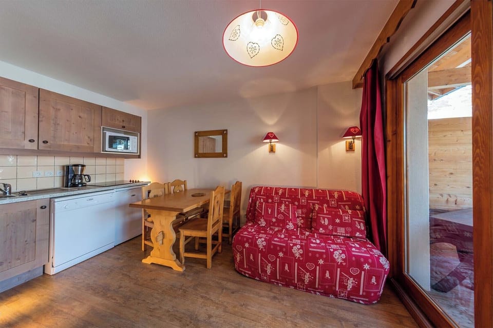 A fully equipped kitchen and dining area, seamlessly blending functionality and comfort for a perfect stay.