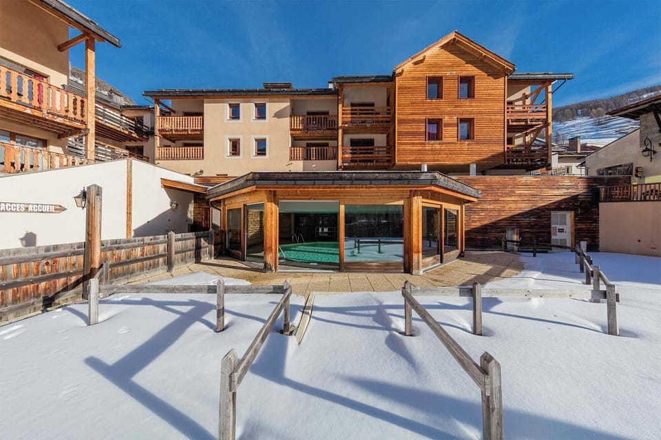 Another angle showcasing the residence’s mountain architecture and its prime location near the slopes.
