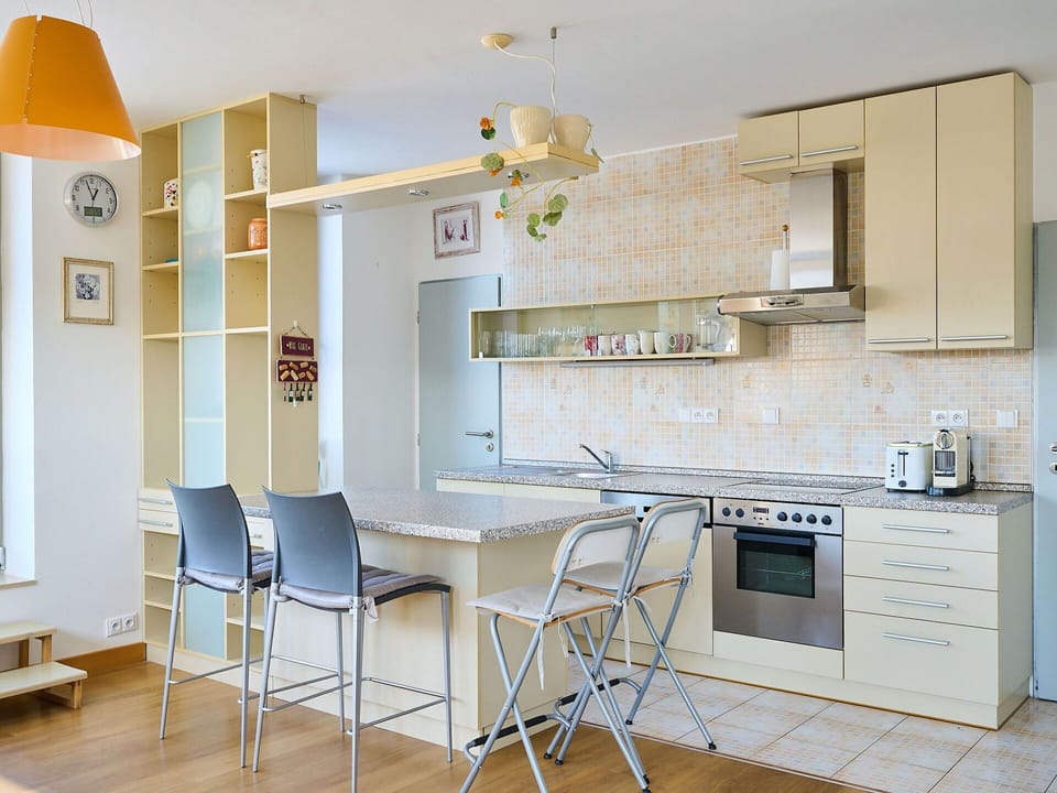 Furniture, Flooring, Kitchen, Interior Design, Floor, Cabinetry, Countertop, Wood, Chair, Kitchen Appliance