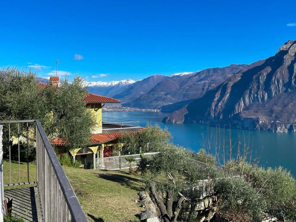 Water, Sky, Plant, Mountain, Azure, Natural Landscape, Tree, Building, Lake, Highland