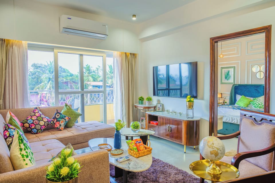 Deluxe Apartment, 2 Bedrooms, Balcony, Pool View | Living area | Flat-screen TV