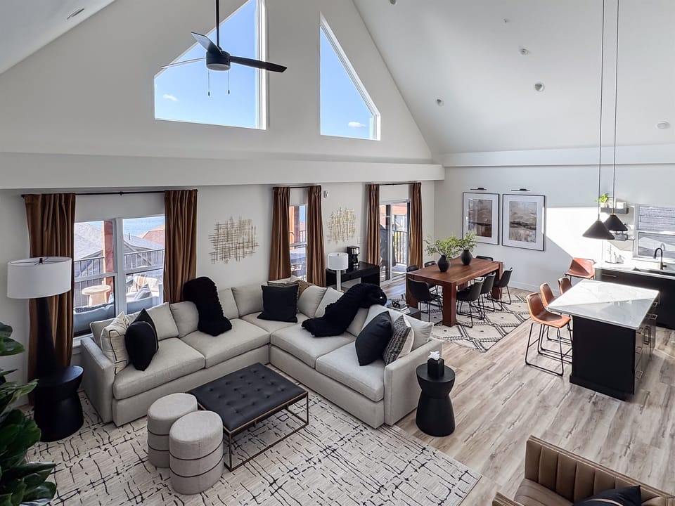Overview of the living room, dining area, and kitchen