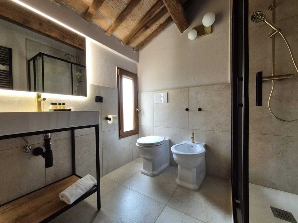 Superior Room | Bathroom | Shower, hair dryer, bathrobes, towels